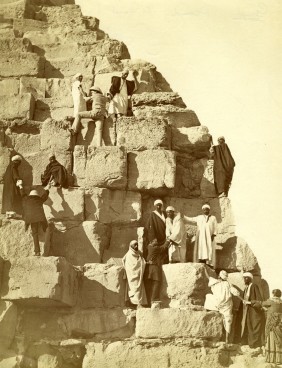 Tourists climbing the Great Pyramid at Giza, late 1800s.